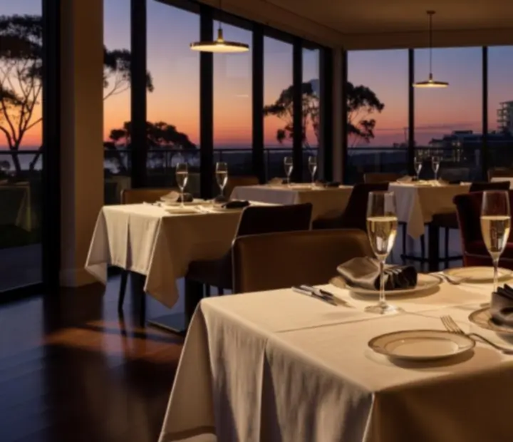 Elegant evening table setting at SuitedUpGrill with soft lighting and champagne tones.