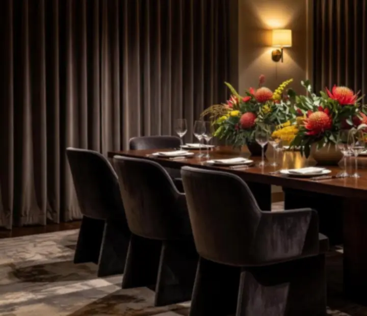 Elegant private dining room with marble table and soft cinematic lighting